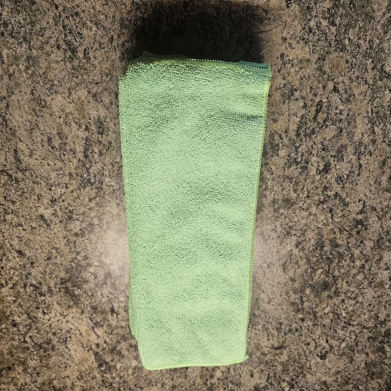 Green color-coded microfiber cloths designated for office surface and desk cleaning Angst Cleaning Lehigh Valley PA